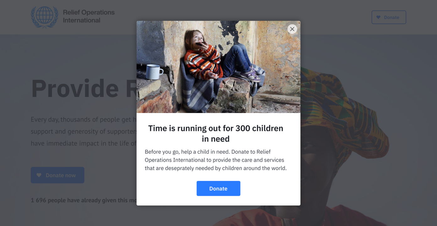 Child sitting on a stone in a dilapidated space, wearing a colorful sweater and looking at the viewer. A donation prompt overlays the image, urging support for children in need.