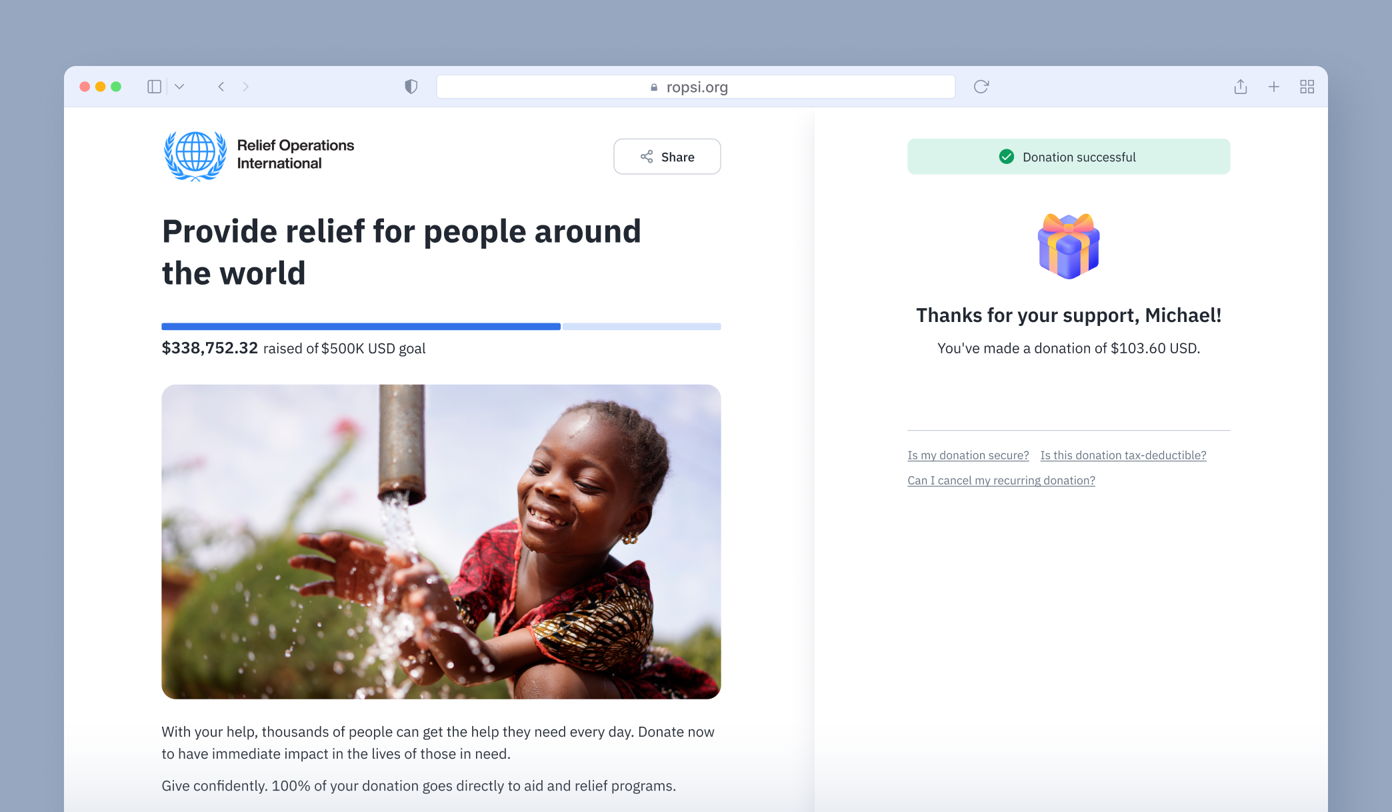 Donation confirmation page showing a progress bar indicating $338,752.32 raised towards a $500,000 goal. A child plays with water from a tap. Text thanks the donor, Michael, for a $103.60 donation.