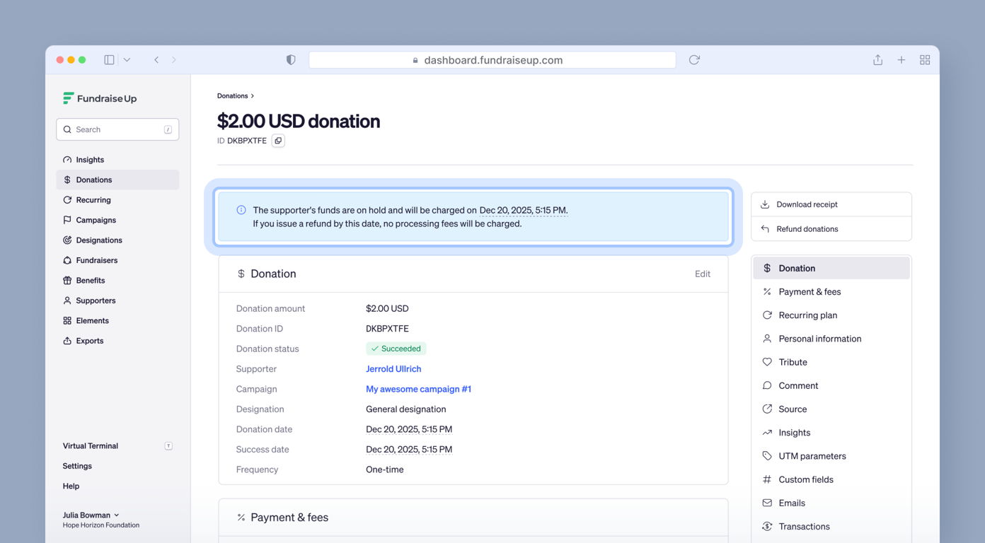 $2.00 USD donation details, including donation ID, supporter name, campaign title, and status. A note indicates funds are on hold and will be charged on December 20, 2025, with a warning about potential fees for refunds.